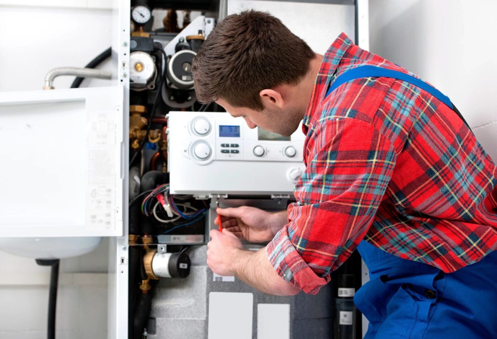 Plumber working on equipment